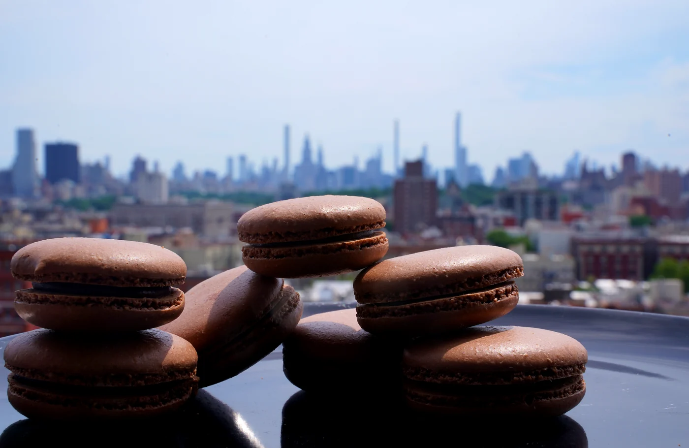 Chocolate macarons above the New York skyline